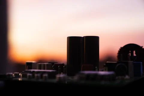 Cinematic Moody Close-up of Electronic Components at Sunset Stock Photos