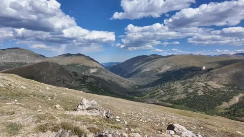 Cinematic motion lapse of the Rocky Mountains with dynamic clouds Stock Footage 339631953