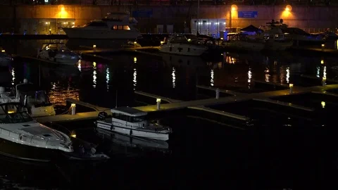 Cinematic night footage of the boats in the old port of the city downtown Stock Footage