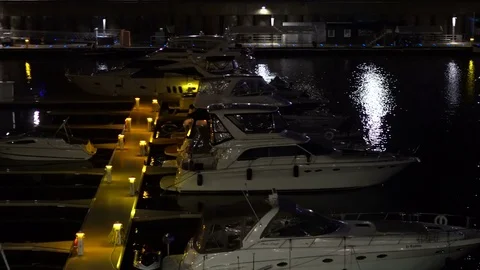 Cinematic night footage of the boats in the old port of the city downtown Stock Footage