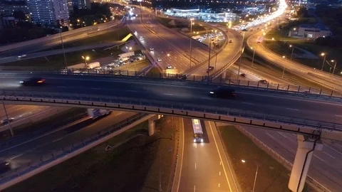 Cinematic night road junction backlit active traffic jam many cars Moscow Aerial Stock Footage 116267758