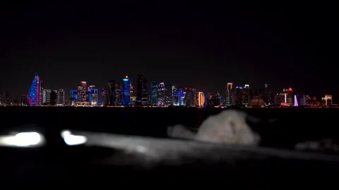 Cinematic night view of the Doha West Bay skyline with blurred foreground. Stock Footage 336717175