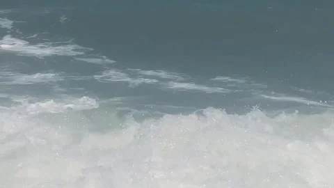 Cinematic ocean waves breaking on beach with blue sky and horizon line Stock Footage 331590601