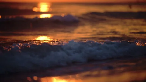 Cinematic ocean waves during golden sunset, calm, romantic and mysterious Stock Footage 326323547