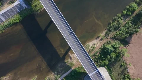 Cinematic Orbit Above River Bridge at Golden Hour Video stock 336857024