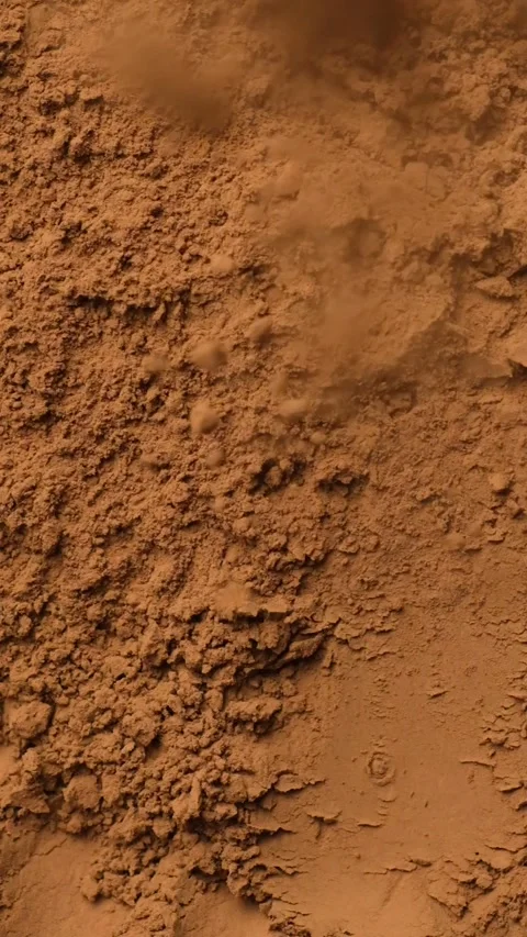 Cinematic overhead view of falling cacao powder for culinary background. Stock Footage 337699046