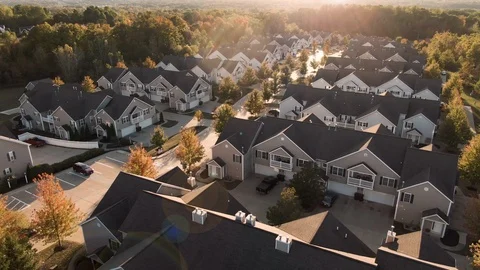 Cinematic Pan Across Apartment Complex at Sunset Stock Footage 117811349
