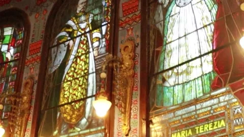Cinematic Pan Left of Ornate Windows and Hanging Lamps in Synagogue Stock-Footage 330369860