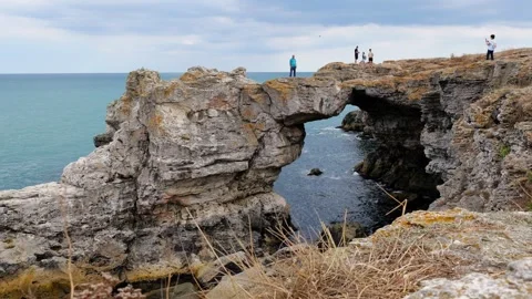 Cinematic panoramic view of the rock arch at Tyulenovo Stock Footage 315460939