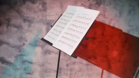 Cinematic, Paper sheets with music notes on a music stand closeup, interior Video stock 304582775