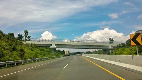 Cinematic point of view inside car driving on tollway Stock Footage 339637567