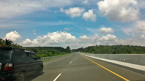 Cinematic point of view inside car driving on tollway Stock Footage 339637568