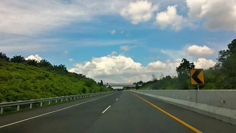 Cinematic point of view inside car driving on tollway at dumai, july 13 2026 Stock Footage 339637577
