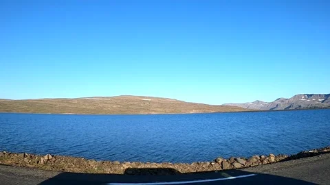 Cinematic POV of a deep blue mountain lake in East Iceland highlands Stock Footage 333843336