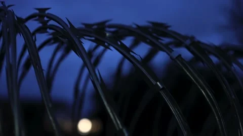 Cinematic Prison Barbed Razor Wire On Fence Exterior, Maximum Security Stock Footage 159133570