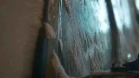 Cinematic, process of cleaning a car covered in snow during the evening Stock Footage 326313578