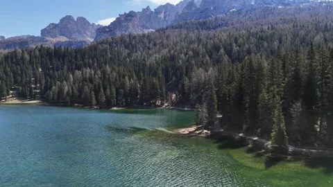 Cinematic Proximity Flight Above Lake Water Revealing Historic Palace Ho Stock Footage 340382000
