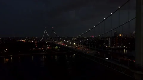 Cinematic Pull-Away from New York City Bridge at Night, 4K Aerial Drone Stock Footage 165359348
