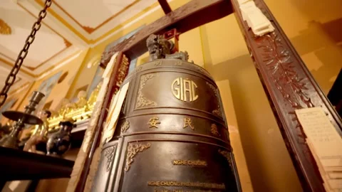 Cinematic Pull Back from Large Buddhist Temple Bell in Vietnam Stock Footage 343872608