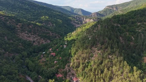 Cinematic pull-out drone shot of Bachkovo mountain valley 스톡 동영상 344761879
