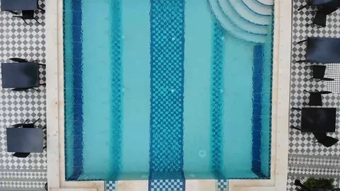 Cinematic Pull up from Swimming Pool to Beautiful Resort Stock Footage 118387021