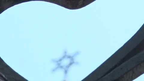 Cinematic Rack Focus on David's Star at the Top of Novi Sad Synagogue Stock-Footage 329695943
