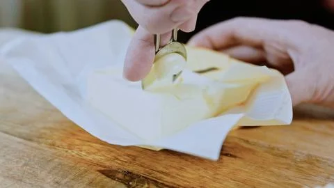 Cinematic recipe ingredient view: cracking eggs into the tomato mixture 스톡 사진