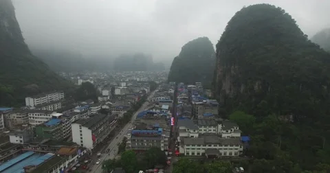 CINEMATIC REVERSE FLY BY OF YANGSHUO TEMPLE ON MOUNTAIN SIDE (1of2) Stock Footage 62688657