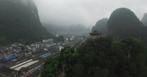CINEMATIC REVERSE FLY BY OF YANGSHUO TEMPLE ON MOUNTAIN SIDE (2of2) Stock Footage 62688786