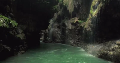 Cinematic River Flow Through Jungle Canyon with Natural Rock Details 動画素材 332607140