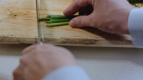 Cinematic savory serving view: cracking eggs into the tomato mixture Stock Footage 342201003