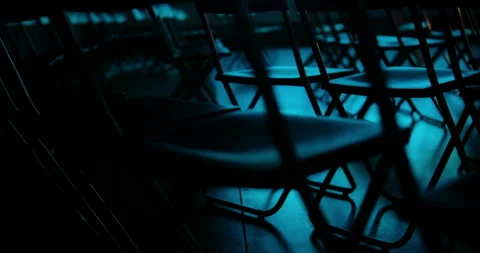 Cinematic scene inside a theater or cinema hall where blue stage ligh Stock-Footage 327842776