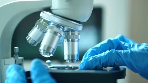 Cinematic Scientist Preparing Covid-19 Blood Sample For Microscope Video stock 135305415