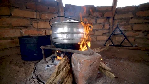 Cinematic short of a POT ON BURNING FIRE  SLOWMOTION Video stock 157603266