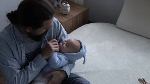 Cinematic Shot Bearded Long-haired Young Neo Picks Up Pacifier Cute Newborn Baby Stock Footage 168445510