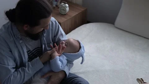 Cinematic Shot Bearded Long-haired Young Neo Father Strokes Face Cute Newborn Stock Footage 198557141