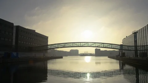 Cinematic shot of a bridge between buildings in golden hour Video stock 113142152