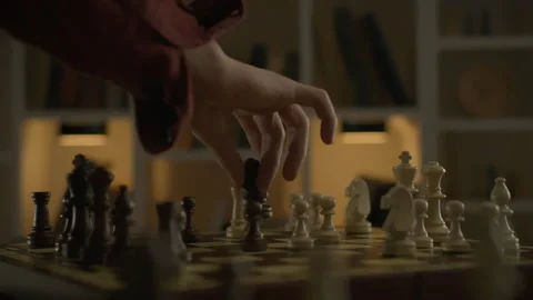 A cinematic shot of a chess move by an experienced player moving the knight Stock Footage 263591994