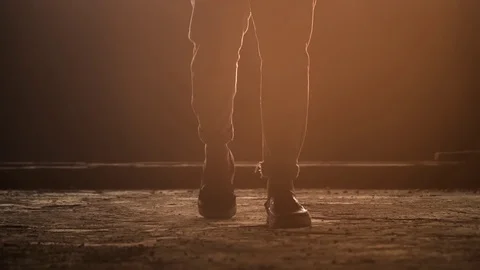 Cinematic shot of footsteps sunset of young man youth enjoying vibes silhouette Stock Footage 107809237