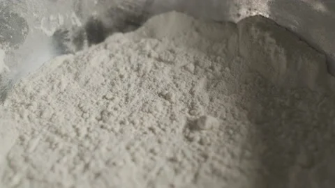 Cinematic shot: Light in motion. Flour close-up. The play of light and shadow Stockbeeldmateriaal 139150997
