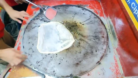 Cinematic shot. The making process of Martabak Telor Stock Footage 276299361