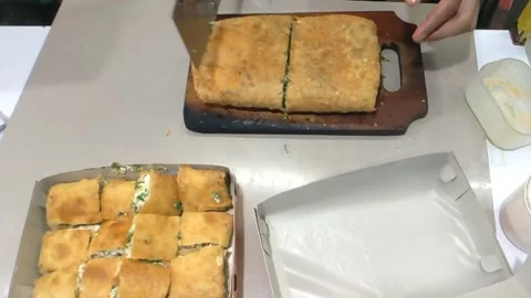 Cinematic shot. The packing process of Martabak Telor Stock Footage 276299357