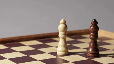 Cinematic shot of rotating chessboard with queens and their shadow. Stock Footage 314379994