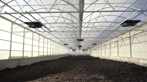 Cinematic Shot of Solar Sludge Drying Greenhouse at Wastewater Facility Vídeos de archivo 334879106