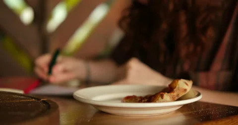 Cinematic shot of a student or freelancer enjoying a meal while working Stock Footage 336511673