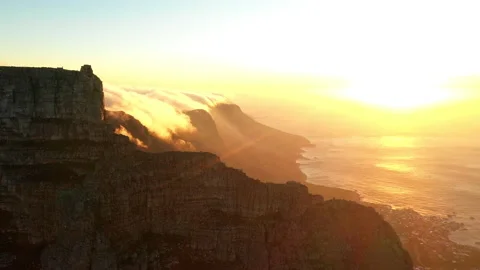 Cinematic shot of Table Mountain at sunset with the ocean in the background Stock Footage 170620771