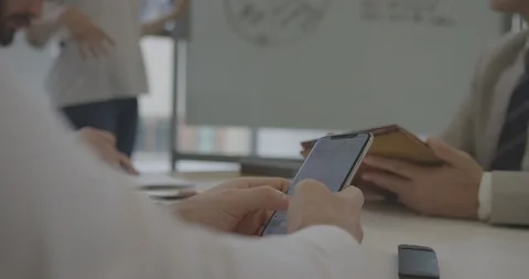 Cinematic shot of taking notes on phone during business meeting in New York City Stock Footage 93203980