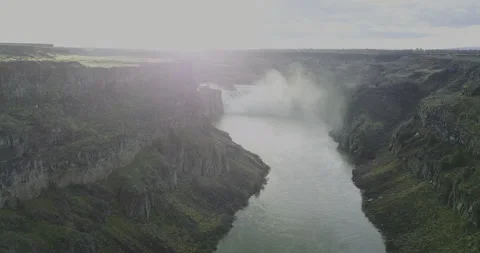 Cinematic Side-Angle Aerial of Shoshone Falls with Rising Mist and Canyon Cliffs Stock Footage 331802213