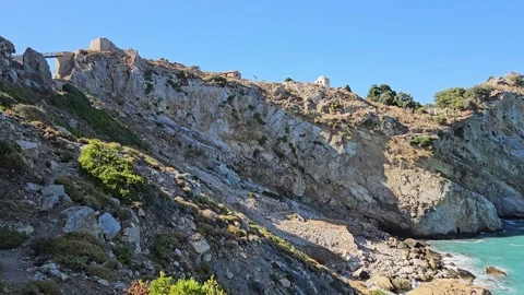Cinematic Side-Panning Shot of Rugged Cliffs at Byzantine Castle, Skiathos Stock Footage 340403370