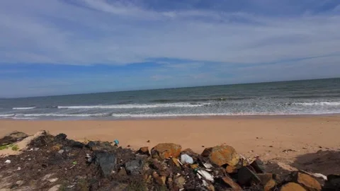 Cinematic side view from a car driving past an environmentally damaged coastal Stock Footage 344398885